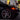 Black Tesla Model 3 front corner with red LED DRL-style light strip