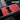 Red center console wrap with two cup holders and a slim slot insert