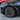 Matte black 19-inch wheel cover with multi-spoke design, installed on car wheel