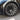 Gun gray wheel cover with multi-spoke turbine design and visible tire