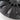 Close-up of black wheel cover spoke blades with smooth curved edges