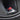 Red aluminum valve stem cap on wheel tire valve stem