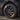 18-inch aero wheel cover on a Tesla Model 3, dark gunmetal spokes with center cap