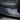 Black door sill protector strip along interior door sill near seat base