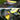 Microfiber car wash towels on car hood, steering wheel, and dashboard; gray and yellow.