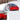 Windshield snow cover with quilted panel on red car windshield, blocking snow buildup
