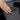 Dark gray textured center console wrap with two cup holder openings and slot