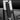 Black seat belt shoulder pad on seat belt strap near the latch