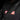 Black seat belt shoulder pad with visible red brand label on fabric